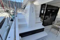 2024 Leopard 40 Powercat yacht deck with stairs and marina view.