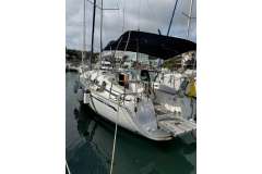 2009 Bavaria 35 Cruiser yacht docked in marina, featuring sleek design and spacious deck.