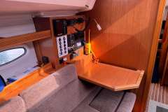 Interior of 2009 Bavaria 35 Cruiser yacht with navigation equipment and wooden desk.