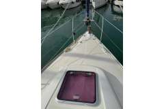 2009 Bavaria 35 Cruiser yacht deck with hatch, docked in marina.