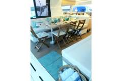 Luxurious dining area on a 2019 Bali 4.1 yacht, featuring elegant table settings.