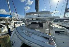 2020 Leopard 50 catamaran docked at marina under clear blue sky.