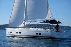2017 Hanse 588 sailboat cruising on open water under clear skies.