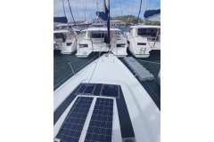 2020 Beneteau Oceanis 46.1 yacht docked, featuring solar panels on deck.