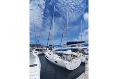 2020 Beneteau Oceanis 46.1 sailboat docked under a vibrant blue sky.