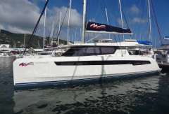 2022 Leopard 50 catamaran docked at a marina with blue sky background.