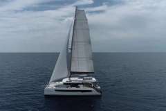 2021 Leopard 42 catamaran sailing on open sea under cloudy sky.