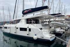 2020 Leopard 45 catamaran docked in a marina, featuring sleek design and modern amenities.