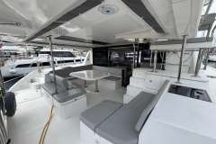 Spacious interior of a 2020 Leopard 45 yacht with modern seating and dining area.