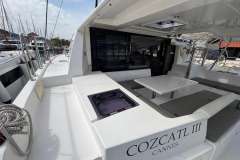 2020 Leopard 40 catamaran with spacious deck and seating area, docked at marina.