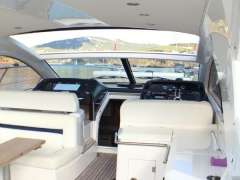 Interior view of 2012 Sunseeker Portofino 48 yacht with modern helm and seating.