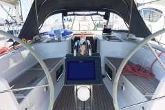 Cockpit of 2010 Hanse 445 sailboat with navigation equipment and seating.