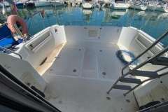 Astinor 1000 boat deck, 1998 model, with marina view and nautical equipment.