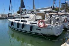 2020 Hanse 388 sailboat docked in marina, featuring sleek design and modern amenities.