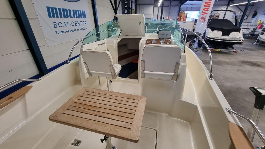 Jeanneau Merry Fisher 585 met Suzuki DF90A en tra