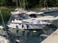 Place d’amarrage 11x3,30m. avec bateau Fester Steg