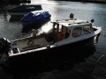 Fischerboot mit Kabine Bateau de pêche