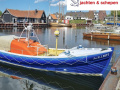 Voormalig Strand reddingboot 10.32 Bote auxiliar